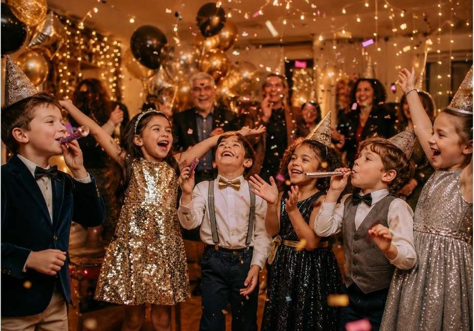 New Year's activities for kids wearing festive party outfits